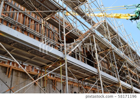 Construction site scaffolding 58171196