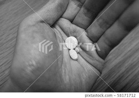 Medicine placed on the palm of your hand Medicine placed on the palm of your hand 58171712