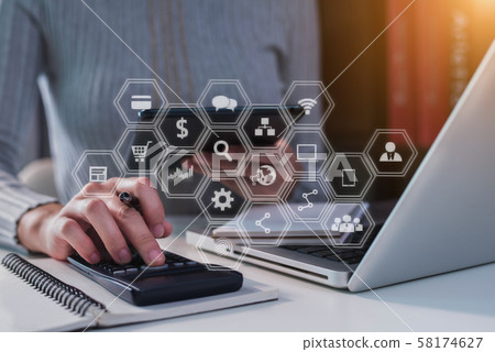 Business woman or accountant working on laptop computer with business document, graph diagram and calculator on office table in office. Business woman or accountant working on laptop computer with business document, graph diagram and calculator on office table in office. 58174627