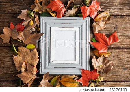 Autumn flat lay with photo frame 58176163