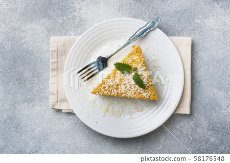 Piece of delicious puff cake with butter cream  58176548