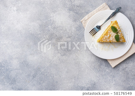 Piece of delicious puff cake with butter cream  58176549