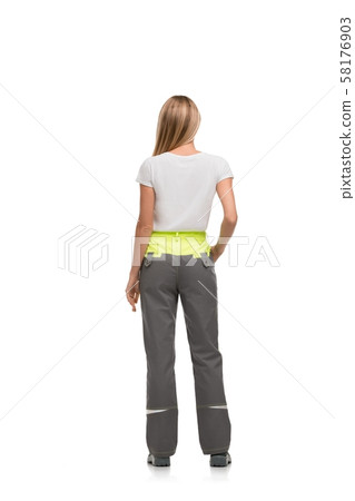 Slim blonde in working clothes isolated rearview Slim blonde in working clothes isolated rearview 58176903