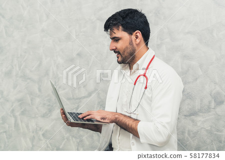 Doctor using laptop computer at the hospital. Doctor using laptop computer at the hospital. 58177834