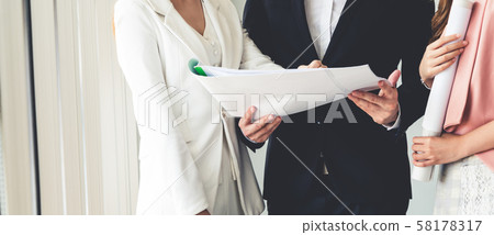 Businessman and businesswomen working in office. Businessman and businesswomen working in office. 58178317