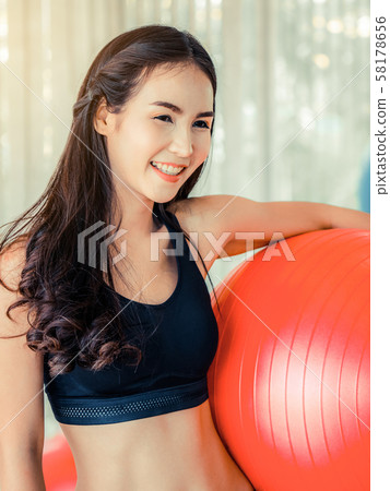 Young woman pilates exercise with fitness ball. 58178656