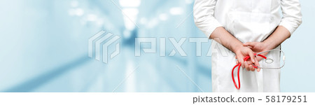 Young male doctor working at the hospital. 58179251