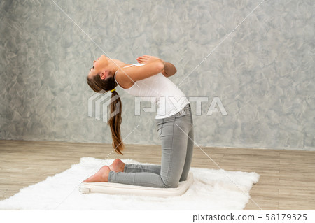 Young woman yoga on carpet at home living room. Young woman yoga on carpet at home living room. 58179325