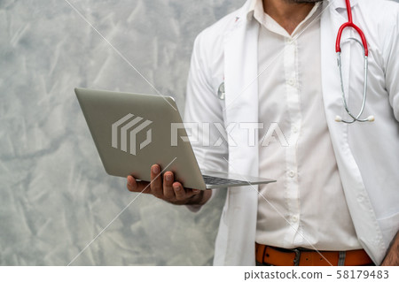 Doctor using laptop computer at the hospital. Doctor using laptop computer at the hospital. 58179483