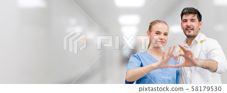 Doctors at hospital working with another doctor. 58179530