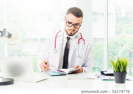Doctor working on laptop computer hospital. Doctor working on laptop computer hospital. 58179776