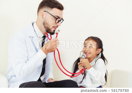 Happy little kid visit doctor in hospital office. Happy little kid visit doctor in hospital office. 58179780