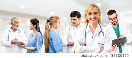 Doctor working in hospital with other doctors. 58180153