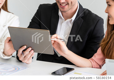 Businessman and businesswomen working in office. 58180154