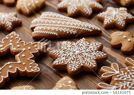 Christmas gingerbread cookies on brown planks Christmas gingerbread cookies on brown planks 58181075