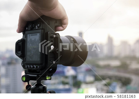 Professional photographer taking photo of city 58181163