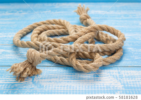 ship rope at wooden board background ship rope at wooden board background 58181628
