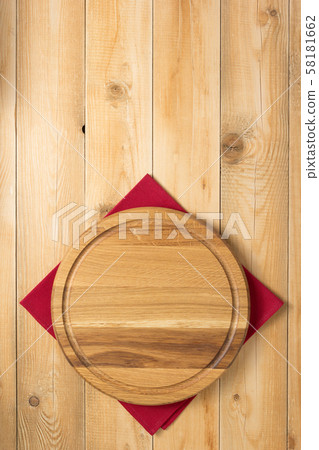 pizza cutting board at rustic wooden table Stock Photo by seregam