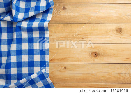 cloth napkin at rustic wooden background, top view 58181666