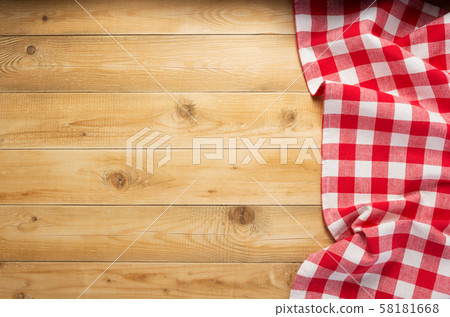 cloth napkin at rustic wooden background, top view 58181668