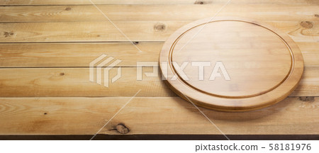 pizza cutting board at rustic wooden table pizza cutting board at rustic wooden table 58181976
