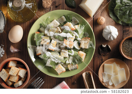 caesar salad in plate at wood 58182023