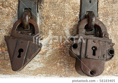 Two ancient rusty padlocks with keyhole Two ancient rusty padlocks with keyhole 58183405