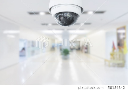 CCTV Security Camera operating in hospital on blur CCTV Security Camera operating in hospital on blur 58184842