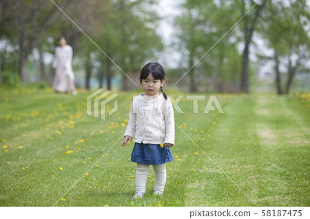 Girls playing in the park Girls playing in the park 58187475