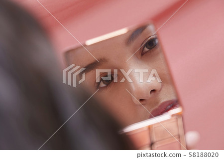 Female beauty over the mirror 58188020