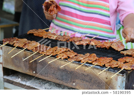 Grilled pork served as breakfast Lunch and dinner 58190395