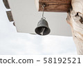 Korean traditional roof with a small bell hanging at the end of the eaves (landscape) 58192521