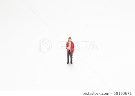 a mni figure stand on the white board 58193671