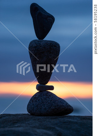 balanced stones on the beach balanced stones on the beach 58195238