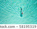 Top down view of a girl swimming in a lagoon 58195319