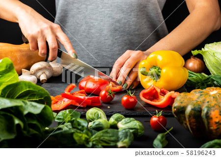 Woman's hands prepare vegetarian food, cut different vegetables. Healthy eating diet concept. Woman's hands prepare vegetarian food, cut different vegetables. Healthy eating diet concept. 58196243