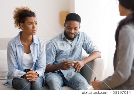Sad Afro Woman Complaining Psychologist About Husband Indifference In Office Sad Afro Woman Complaining Psychologist About Husband Indifference In Office 58197014