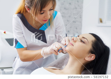Body Care. Woman Receiving Face Skin Analysis. Cosmetology Body Care. Woman Receiving Face Skin Analysis. Cosmetology 58197132