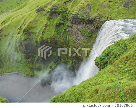 Beautifull waterfall Skogafoss on the Skoga River viewed from up. Summer landscape on a sunny day Beautifull waterfall Skogafoss on the Skoga River viewed from up. Summer landscape on a sunny day 58197966