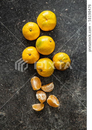 Fresh yellow tangerines. 58198476
