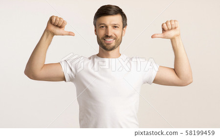 Guy Pointing Thumbs At Himself On White, Studio Shot Guy Pointing Thumbs At Himself On White, Studio Shot 58199459