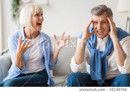 Senior couple quarrelling with each other at home 58199768