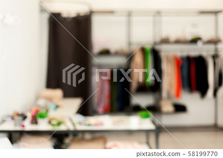 Blurred Background Of Fashion Designer Workshop With Clothes Hanger Stand Blurred Background Of Fashion Designer Workshop With Clothes Hanger Stand 58199770