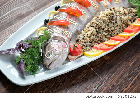 Stuffed fish with vegetables and rice. catering menu 58201252