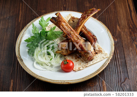 Skewers on the bone with vegetables and herbs. catering menu 58201333