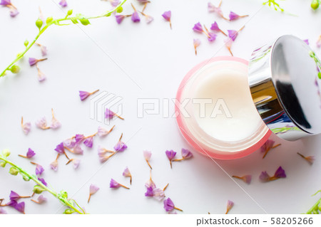 Skin moisturizing cream and stylish flowers Skin moisturizing cream and stylish flowers 58205266