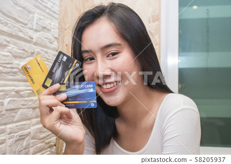 Asia woman show plastic credit card Asia woman show plastic credit card 58205937