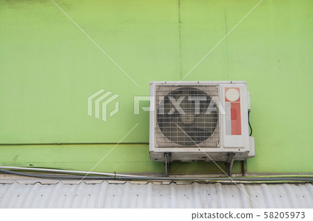 air compressor on the green wall outdoor 58205973