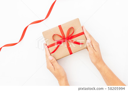 Female hands holding present box or gift box 58205994