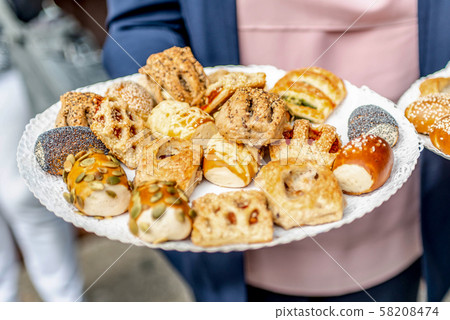 Different kinds of bread rolls on plate from above. Kitchen or bakery poster design 58208474